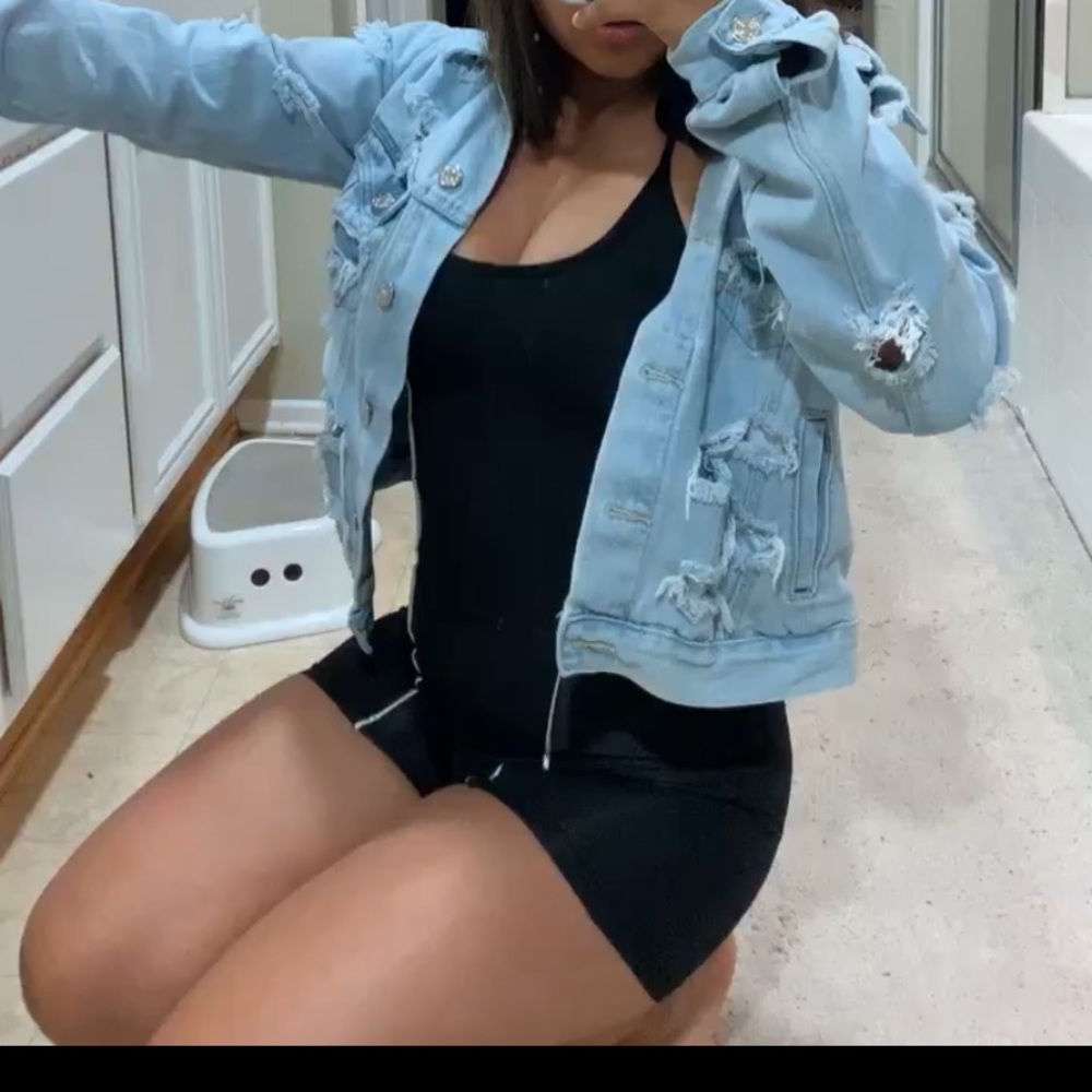 A black romper with two reflective lines